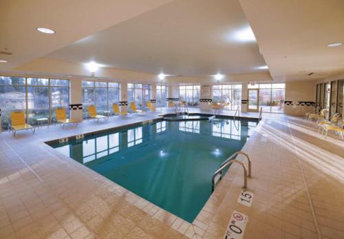 a large swimming pool in a hotel room at Fairfield Inn & Suites by Marriott Wausau in Weston