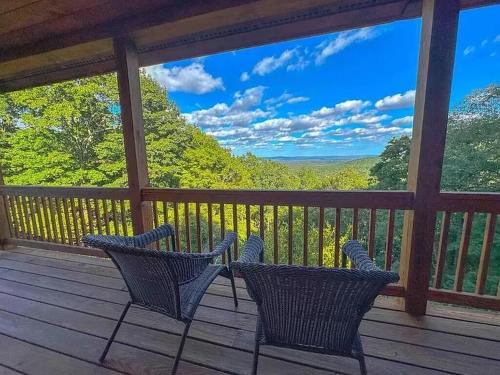 two chairs on a porch with a view of the mountains at Haven View Retreat in White Haven