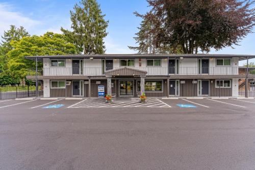 an empty parking lot in front of a building at Interurban Suites Hotel, a Dazzler Select by Wyndham in Tukwila