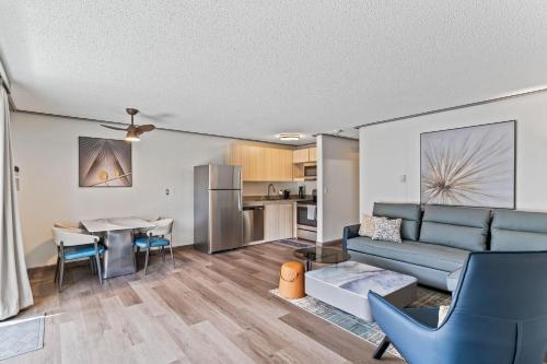 a living room with a couch and a table at Interurban Suites Hotel, a Dazzler Select by Wyndham in Tukwila