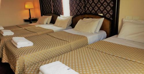 two beds sitting next to each other in a hotel room at Abasto Hotel in Buenos Aires