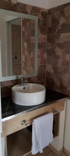 a bathroom with a sink and a mirror at Balcon al dique in Las Chacras