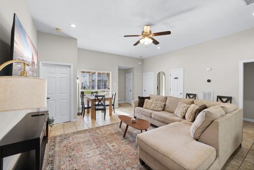 a living room with a couch and a table at Spacious 2BR House, Steps from A&M - King - Patio in College Station