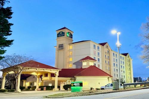 a large building with a clock tower on top of it at La Quinta by Wyndham Haywood Mall-Near Greenville Downtown in Greenville