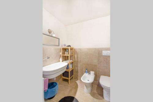 a bathroom with a sink and a toilet at Dimora nei Sassi in Matera