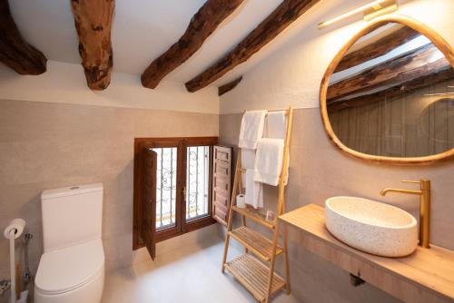 a bathroom with a sink and a mirror at Hotel Caseta Nova in Castalla