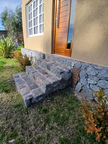 a stone stairway in front of a house at Cabaña la Monita in Tandil