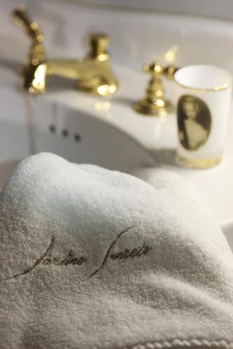 a towel on top of a bathroom sink at Jardins Secrets in Nîmes