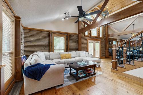 a living room with a couch and a table at Bacliff Family Getaway w/ Game Room + Private Pool in Bacliff