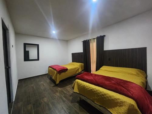 a bedroom with two beds in a room at Quinta el molino in Parras de la Fuente