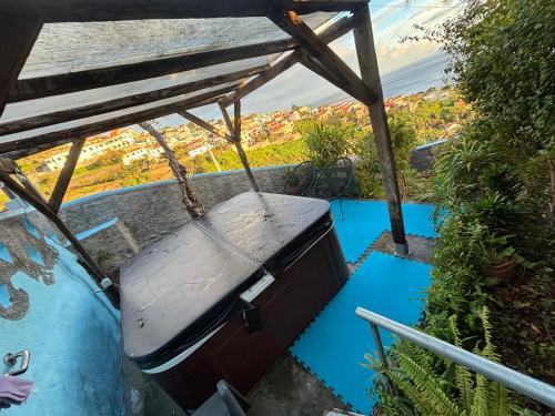 a swing sitting on the side of a balcony at Granny House Madeira in Funchal
