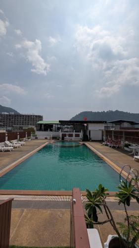 a large swimming pool on top of a building at Issara Patong in Patong Beach