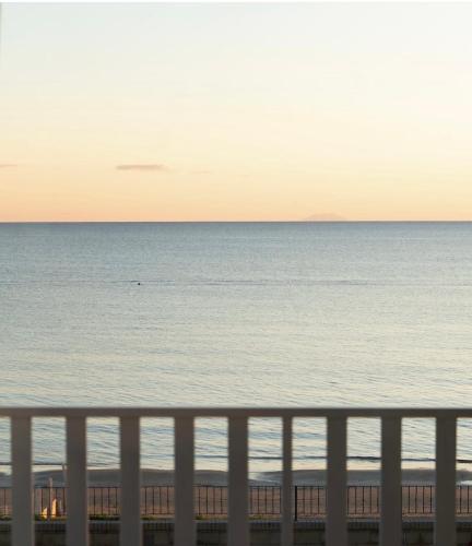 a view of the ocean from the balcony of a beach at Life House B&B in Follonica