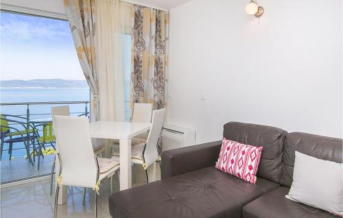 a living room with a couch and a table at Beautiful Apartment In Brela With Wifi in Brela