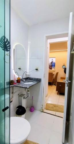 a bathroom with a sink and a toilet at Apartamento paid'egua completo em Belém in Belém