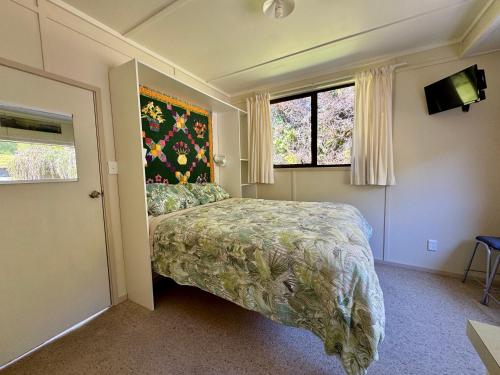 Ridgehaven Accommodation tesisinde bir odada yatak veya yataklar