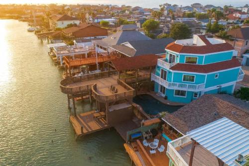 an aerial view of a large house on the water at Blizzard's Lighthouse home in Port Isabel