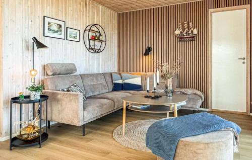 a living room with a couch and a table at St Croix in Hadsund