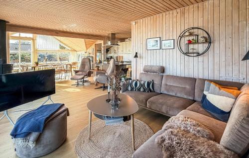a living room with a couch and a table at St Croix in Hadsund