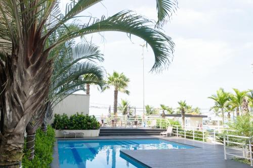 A piscina localizada em Apartamento Praia do Pepê ou nos arredores
