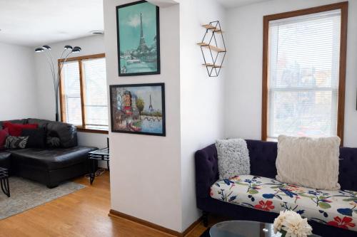 a living room with a couch and a chair at Location! Location! 2bd 1bth spacious apartment! in Chicago