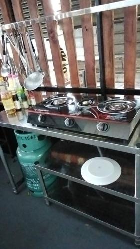 a kitchen with two stove tops on a counter at Crowd free own pace and space in Rayong in Ban Chak Khamin