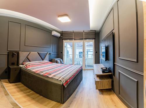 a bedroom with a large bed and a window at Villa Sveti Gorgi in Ohrid
