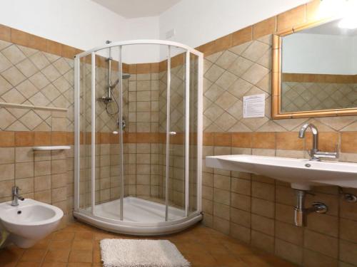 a bathroom with a shower and a sink and a toilet at Studio for couples in Capo Vaticano with pool in Capo Vaticano