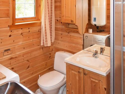 a bathroom with a toilet and a sink at 4 person holiday home in olden in Olden