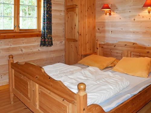 a bedroom with a bed in a log cabin at 6 person holiday home in olden in Olden