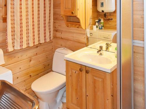 a bathroom with a toilet and a sink at 6 person holiday home in olden in Olden