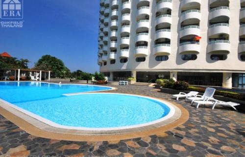 a swimming pool in front of a building at Home at the Gulf of Thailand 1 in Ban Pak Khlong Phe