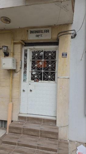 a white garage door with a horse in the window at Huzur 20 in Edirne