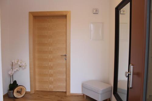 a room with a door and a stool and a door at Bergchalet Rauch in Arzl im Pitztal