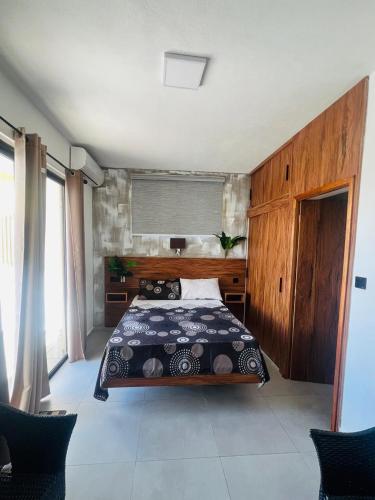 a bedroom with a bed in a room at Cloudview Villa in Mahébourg