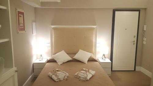 Una cama o camas en una habitación de Scala Suite