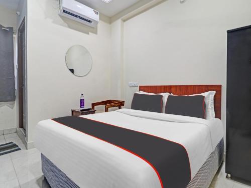 a bedroom with a large bed in a room at HOTEL PNR SUITES KUKATPALLY in Hyderabad