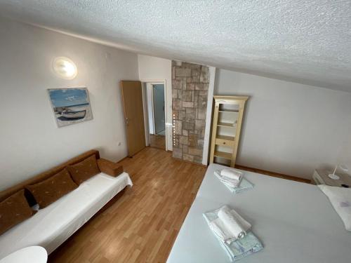 a room with a bed and a ladder in it at Apartment Bugenvila in Vrboska