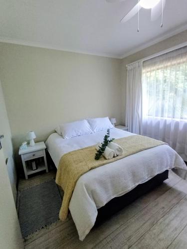 a bedroom with a bed with a christmas tree on it at GreenPeace in Stellenbosch
