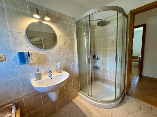 a bathroom with a sink and a shower at Dům pod horami - Beskydy in Frýdlant nad Ostravicí