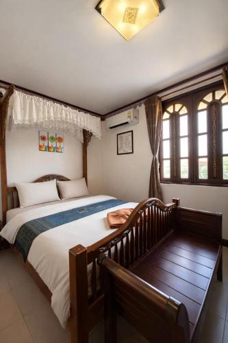 a bedroom with a large bed in a room at Ban Ao Thong in Trang