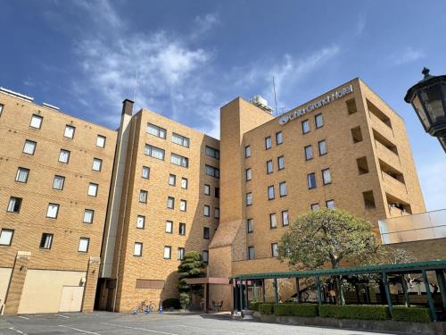 a large brick building with a building at Ohta Grand Hotel in Ota