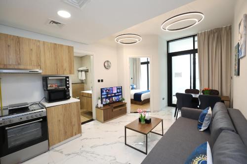 a living room with a couch and a tv in a room at Maryah Island 1 Bed Junior Next to Cleveland Hospital by Central Stay in Abu Dhabi