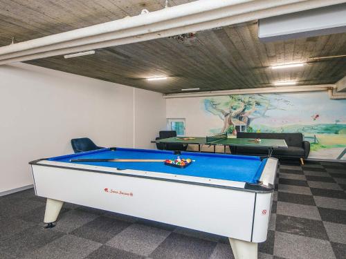 a office with a pool table in a room at 4 person holiday home on a holiday park in Hejls in Hejls