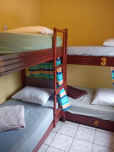 a group of bunk beds in a room at Hostel One Love Lençois in Lençóis