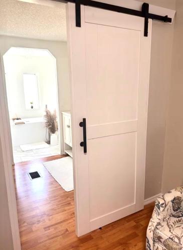 a door leading into a room with a bedroom at Flossies in Seabrook