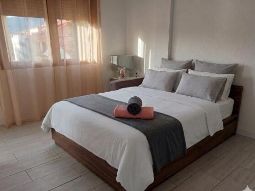 a bedroom with a large bed with a red box on it at Hervas Centro Apartamento IDEAL FAMILIAS 6 adultos y 2 niños- in Hervás