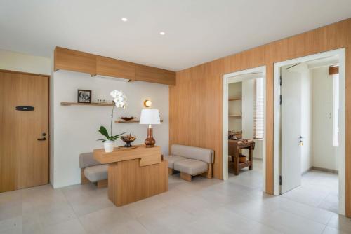a living room with a desk and a chair at ARTOTEL Leguna Magelang in Magelang