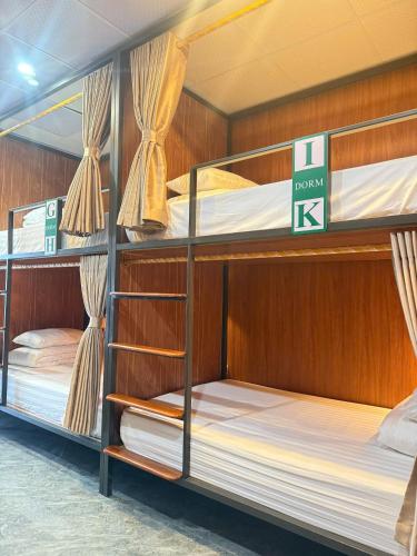 a room with three bunk beds in a boat at The Sun Backpacker Hostel in Ninh Binh