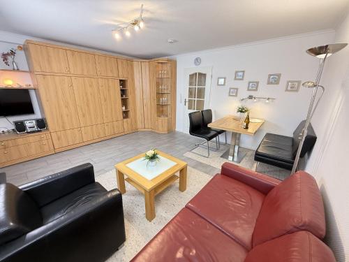a living room with a couch and a table at Wiking, App 019 in Westerland